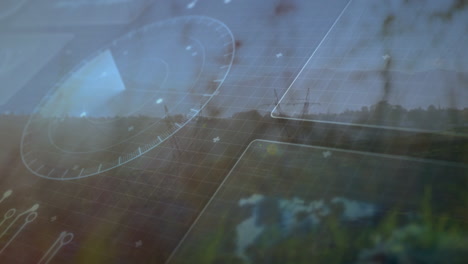 futuristic interface with data processing animation over landscape and windmill