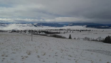 lawn covered with white snow in a winter wonderland landscape in the nicola valley canada on a cloudy day