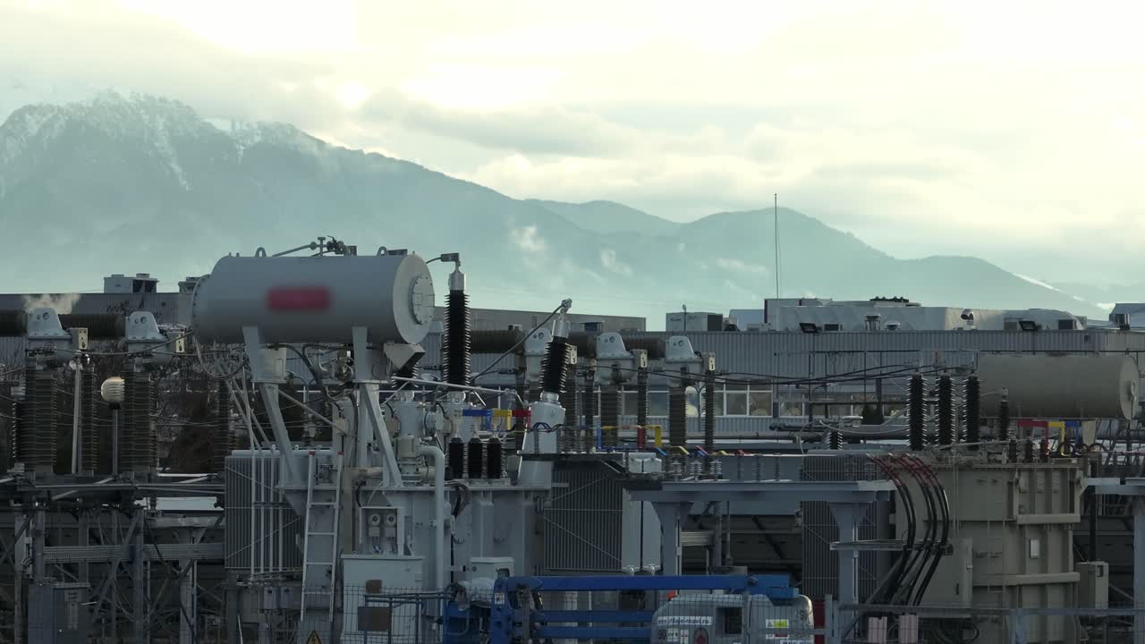 View of an industrial plant with mountains in the background