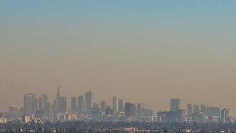 tilt down from blue skies to the smog filled downtown of los angles