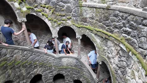 moss-covered arches in the forest of quinta da regaleira, sintra portugal create a mystical scene