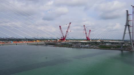 suspension cables and cranes in gordie howe international bridge construction final phase