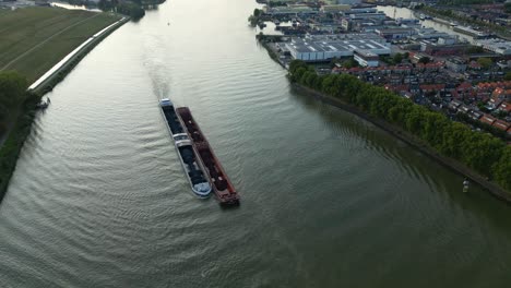 Cargo-ship-with-coal-bulk-load-on-the-Binnen-Merwede-river-in-Sliedrecht,-Netherlands