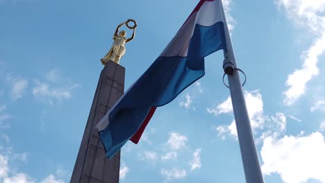 golden lady of luxembourg with flag