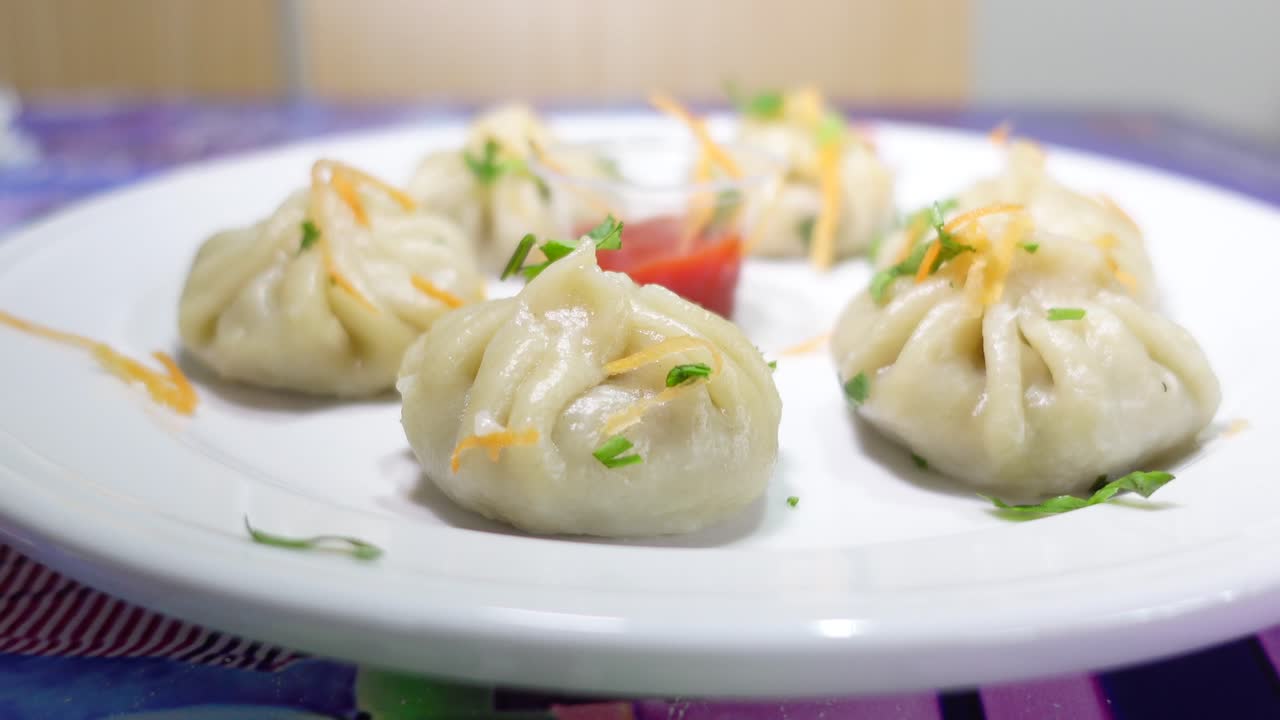 Plate of Steamed Momos with Sauce