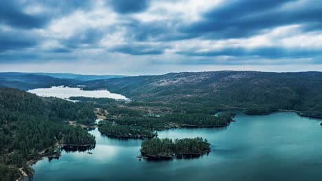 aerial view of a bjornsdalvatnet lake and the forest surrounding it, in the valley of bjorndalen, trondelag, norway