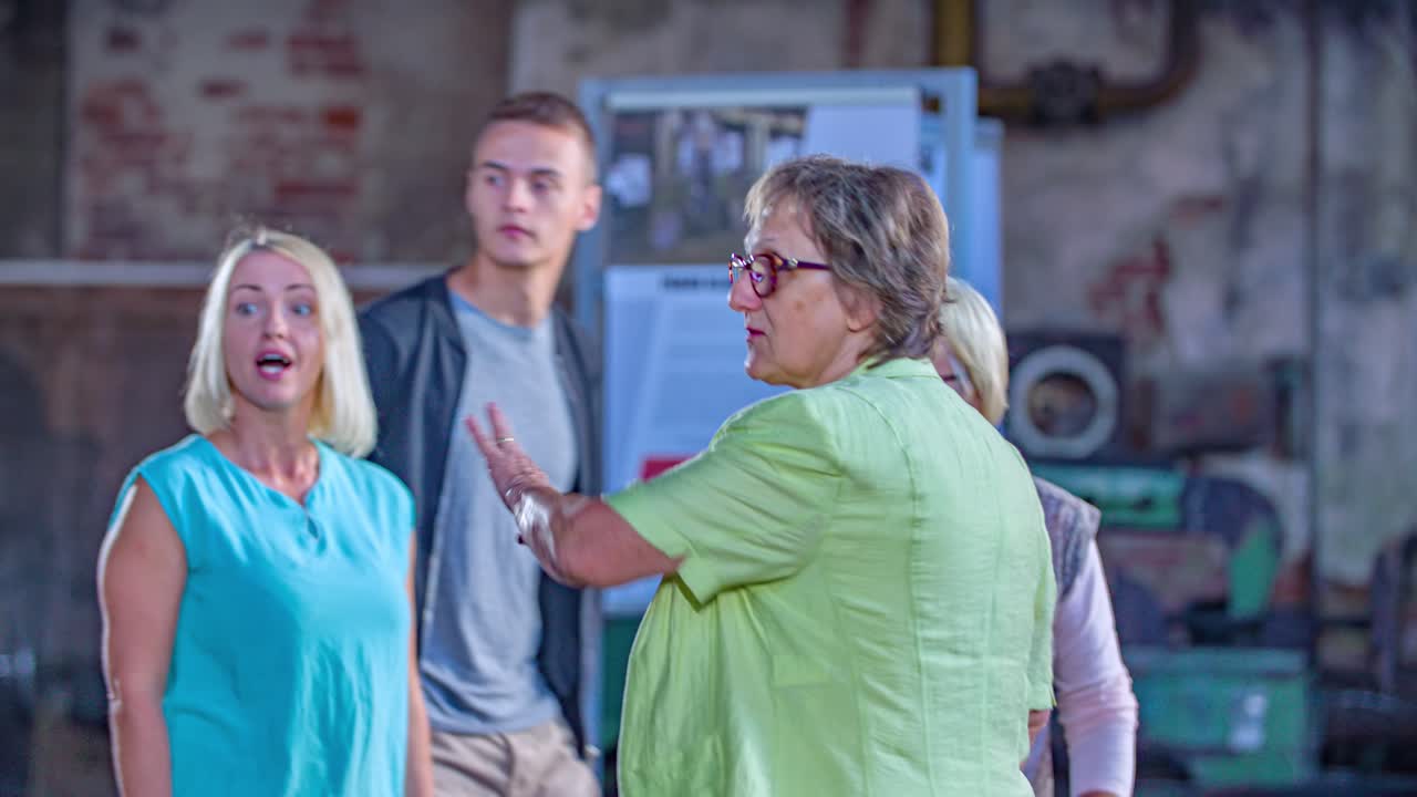 group of people guided visit to museum. Slow motion, dolly out