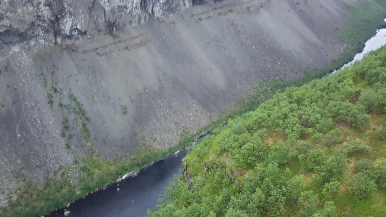 Vertiginious drone footage over Alta Canyon cliffs. Stunning colors on forest tree leafs and almost black river. Water is there drinkable straight from river.