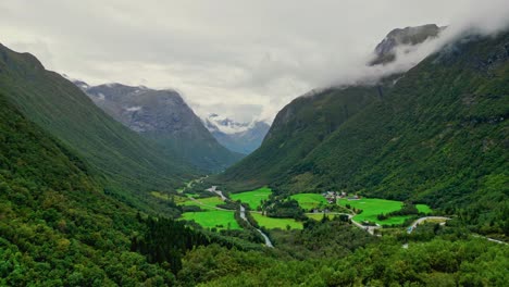 aerial towards videseter among the cloud covered high valleys near hjelledalen, norway