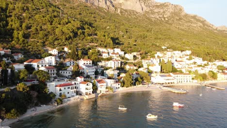 aerial sunset shot of brist, croatia, overlooking the serene adriatic sea and coastal village landscape