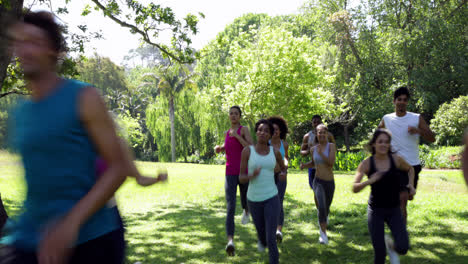 fit group of friends racing towards the camera