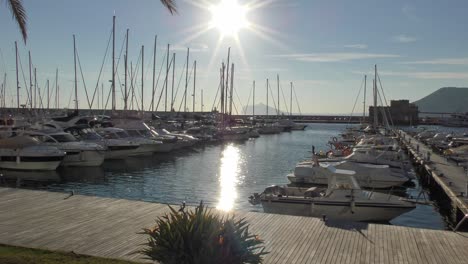 calpe spain late afternoon sunshine on boats in the marina on a warm winter day