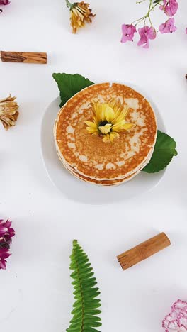 beautiful pancake display with flowers and cinnamon