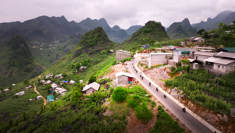 motorcyclists ride scenic ha giang loop past villages and epic landscape