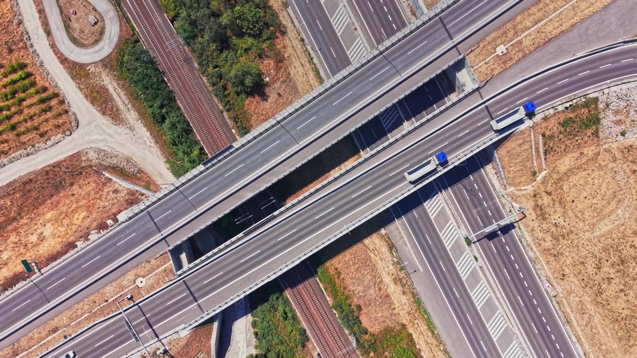 Highway intersection with railway tracks in a rural area