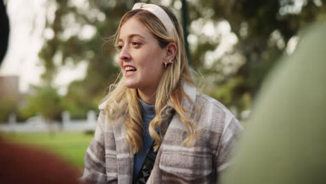 a woman with a headband in a park