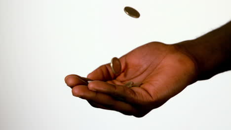 Businessman-catching-falling-coins-in-hand