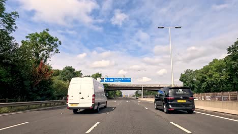 vehicles traveling on highway under clear skies