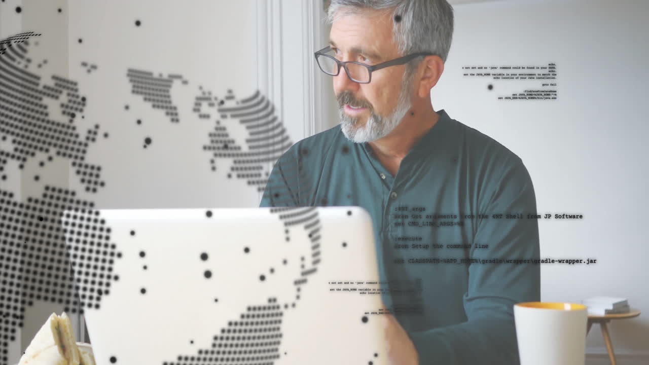 Animation of global network over senior caucasian man in glasses using laptop at home