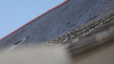 slate roof tiles secured with hooks wide shot