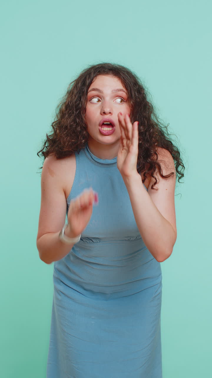 Young woman whisper news rumors holding hands near mouth share gossip quiet keep my secrets