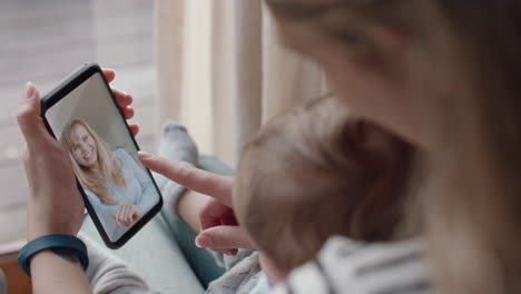 young mother and baby having video chat with best friend using smartphone waving at toddler happy mom enjoying sharing motherhood lifestyle