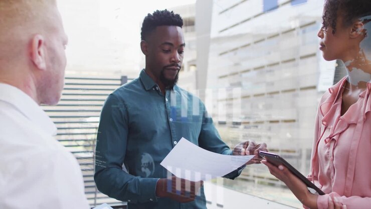 Animation of financial data processing over diverse business people in office