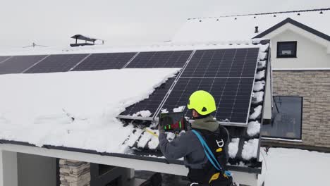 repairman with modern tablet figure out error on solar panels