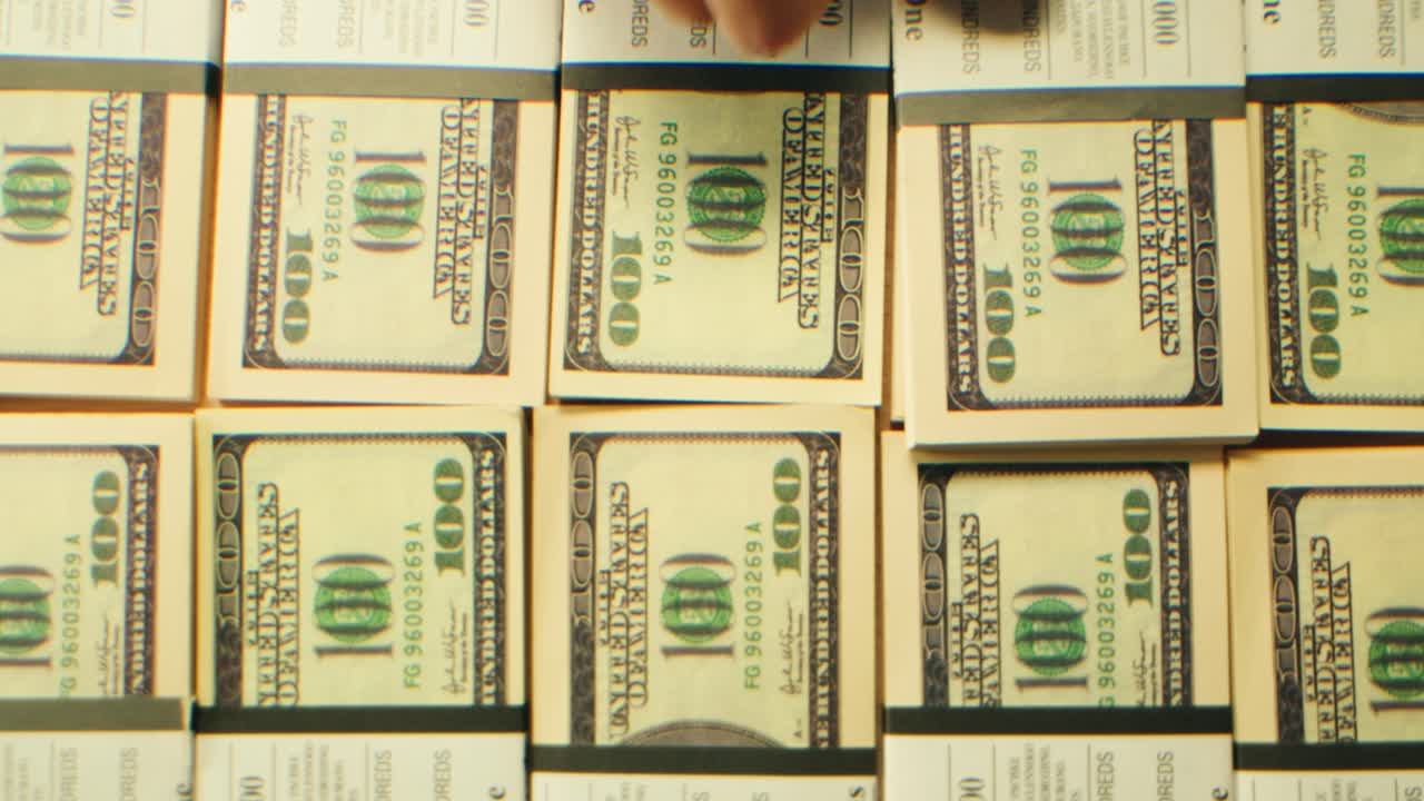 Stacks of cash dollars and euro, Banknotes counting, Specialised police officer Counting dollar euro banknotes in crime lab with machine, cashed out money, bitcoin changing, buying home flat in bank.