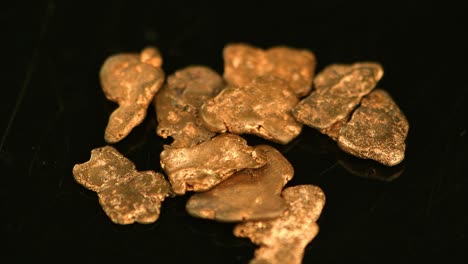 rotating gold nugges (close up footage; selective focus)