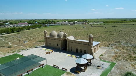 comprehensive view of arystan bab mausoleum in kazakhstan - drone flying forward