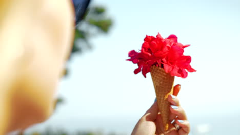 red flower and waffle cone composition