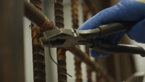 Ironworkers-close-up-twisting-wire-with-pliers