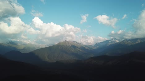 majestic mountain range under a cloudy sky