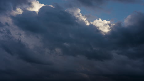 white clouds building up and dark clouds moving overhead