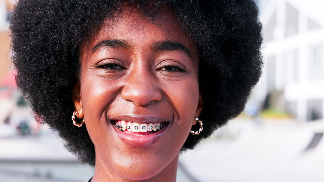 Face, braces and a black woman closeup in the city