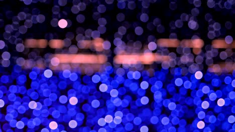 night abstract background is defocused with nice bokeh. blurred christmas lights bokeh. pan across blur .