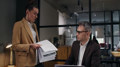 Business Colleagues Discussing Documents in Modern Office