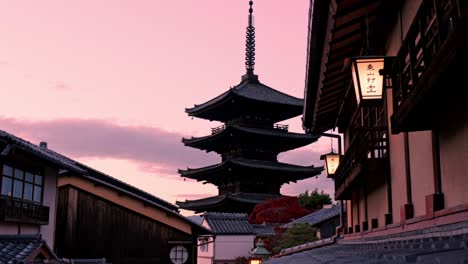 the yasaka pagoda stands tall against the glowing hues of the sunset, casting a serene silhouette in the heart of kyoto.