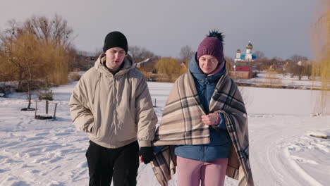 couple walking in winter park