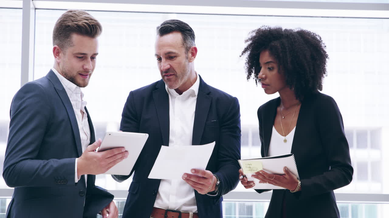 4k footage of three colleagues having a discussion