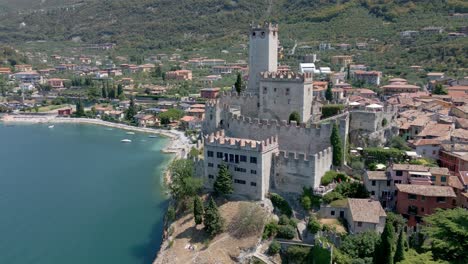 Aerial-approach-towards-Castle-of-Malcesine-in-Verona-Italy