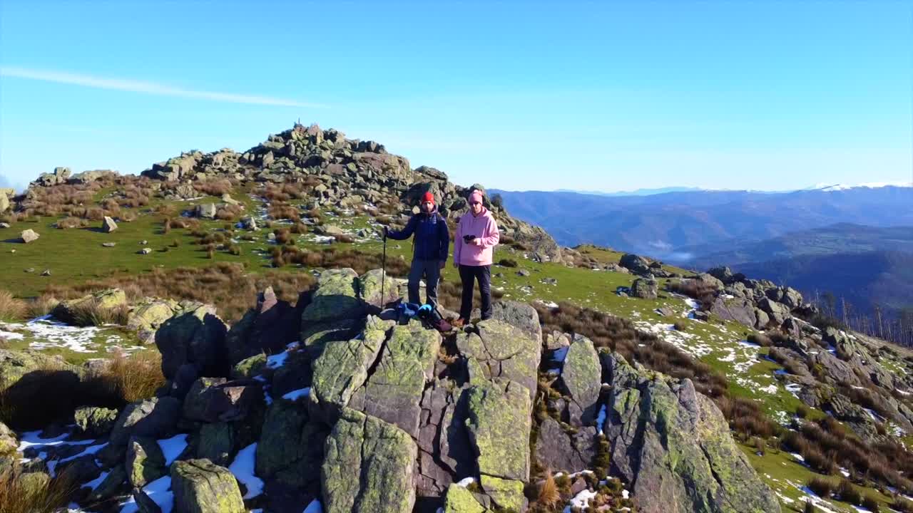 Hikers on a Rocky Mountain Top