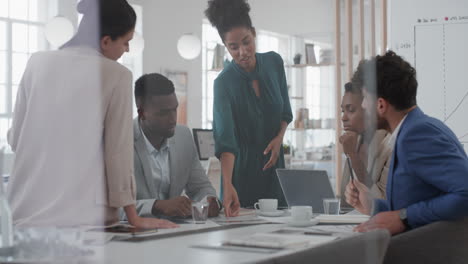 corporate business team meeting mixed race woman manager brainstorming with colleagues discussing project strategy sharing ideas in office