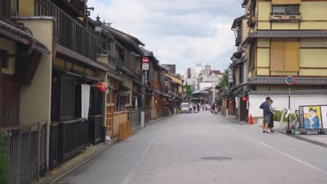 slow motion pan in popular geisha district of gion, summer view of traditional japanese streets