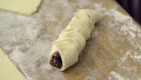 a pastry being picked up with a knife