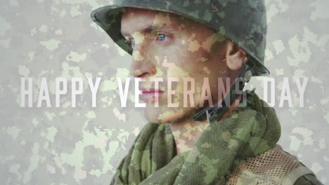 animation of happy veterans day text over pensive soldier in uniform