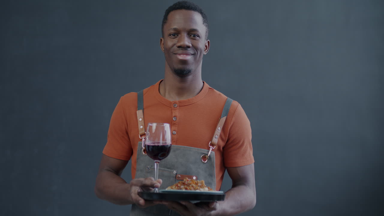 Waiter Serving Food and Wine