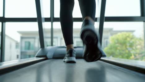 running on a treadmill at gym