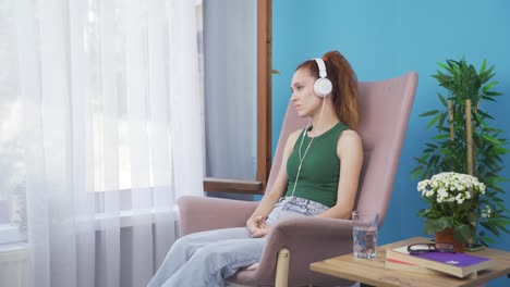 unhappy woman listening to music with headphones.